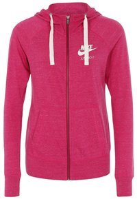 Haut à zip fuchsia avec capuche à cordon, poches kangourou et logo Nike blanc. Tissu doux et texturé avec une coupe décontractée.