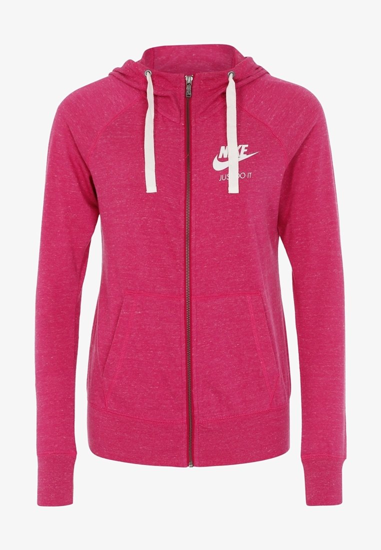 Haut à zip fuchsia avec capuche à cordon, poches kangourou et logo Nike blanc. Tissu doux et texturé avec une coupe décontractée.