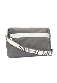 Gray nylon crossbody bag with a white zipper and a patterned, adjustable strap featuring black text. Smooth texture and rectangular shape.