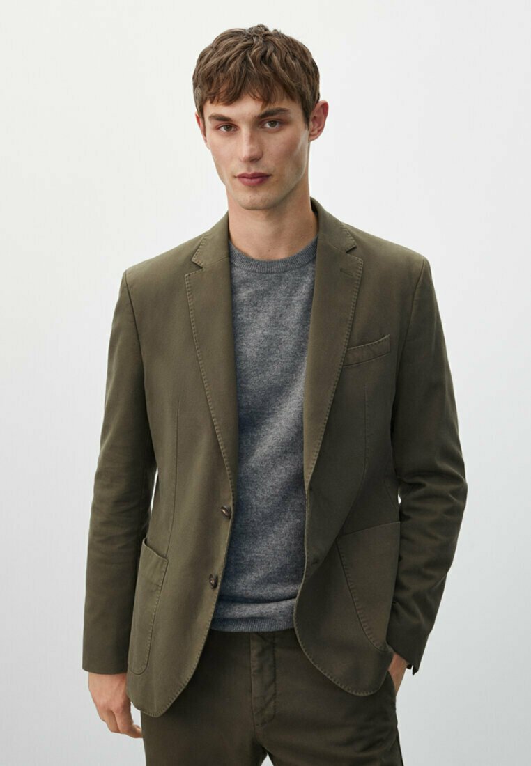 grey jacket with khakis