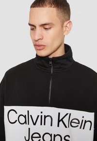 Calvin Klein Jeans BOLD LOGO COLORBLOCK ZIP UNISEX - Sweatshirt - black