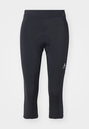 Collants de cyclisme noirs trois-quarts en matériau lisse et extensible. Dotés d'un insert rembourré et d'un petit logo sur le bas de la jambe.