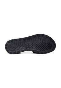 Sole di scarpa in gomma nera caratterizzata da un motivo di battistrada con perni esagonali per una migliore aderenza, contrassegnata con la misura 36. Superficie piatta e texturizzata.