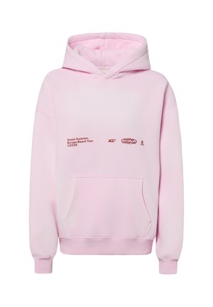 Light pink hoodie with front pocket and red text reading "Sweet Summer. Europe Beach Tour 2026" and small brand logos across the chest.