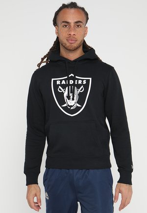 Black fleece hoodie with long sleeves, front pocket, and a large white Raiders logo on the chest. Features a drawstring hood.