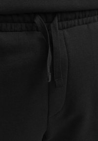 Jack & Jones PREMIUM Spodnji deli trenirk - schwarz
