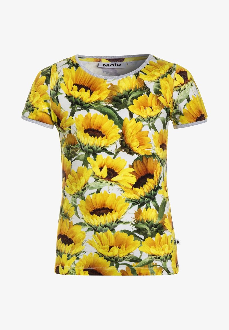 Chemise à manches courtes avec un motif de tournesols vibrant sur fond blanc. Fabriquée en tissu jersey, elle possède un col rond et un design ajusté.