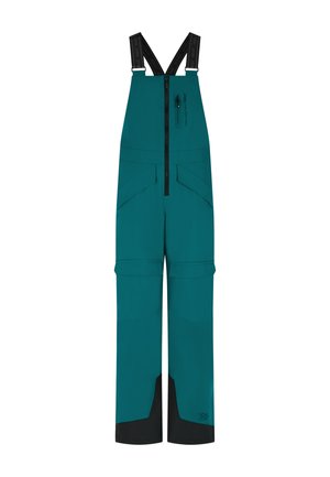 Teal waterdichte bretels met verstelbare zwarte banden, een rits aan de voorkant en meerdere zakken. Bevat zwarte accenten aan de zoom.