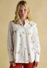 White button-up shirt with colorful food and drink-themed embroidery. Long sleeves, standard collar, and relaxed fit.