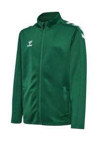 Green zip-up jacket made of smooth fabric. Features a high collar, side pockets, and white chevron accents on the shoulders.