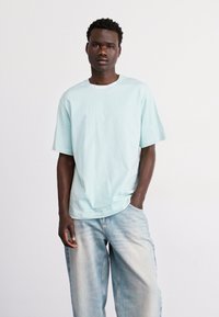 The North Face ZUMU RELAXED TEE - Majica kratkih rukava s printom - muted pine