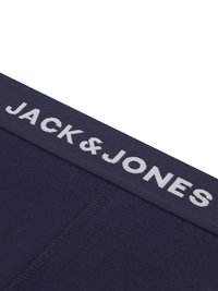 Marineblaue Boxershorts mit einem breiten elastischen Bund, auf dem "JACK & JONES" in hellgrauer Schrift steht, aus glattem Stoff und in körpernaher Passform.