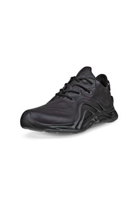 Black athletic shoe with a sleek, textured surface, curved design, prominent laces, and a distinctive outsole profile.