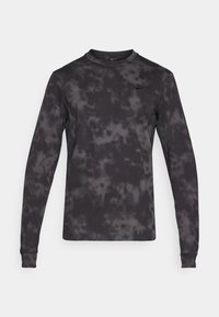 Long-sleeve black shirt with a dark gray tie-dye pattern, round neck, and Nike logo on the chest; cotton fabric with smooth texture.
