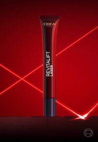 L'Oréal Paris Revitalift Laser creme tube på en rød baggrund med krydsende glødende laserlinjer.