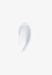 Hvit, kremaktig tekstur som ligner på en glatt dråpe, med en blank overflate og subtil krumning, satt mot en enkel bakgrunn.