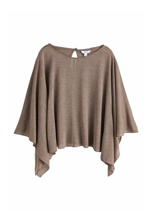 Vaaleanruskea, löysä ponchotyyppinen paita, jossa on leveät hihat ja avonaisen kaulan takana oleva nappikiinnitys.