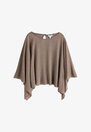 Vaaleanruskea, löysä ponchotyyppinen paita, jossa on leveät hihat ja avonaisen kaulan takana oleva nappikiinnitys.