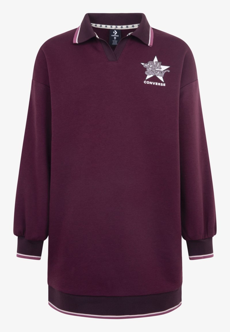 Polo majica dugih rukava u tamnocrvenoj boji s V-izrezom, kontrastnim ovratnikom, gumiranim logotipom i prugastim manžetama. Izrađena je od meke pamučne mješavine.