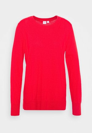 Pull à manches longues rouge en tissu doux. Doté d'un col rond, de poignets côtelés et d'un ourlet droit. Design simple et uni.