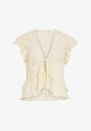 Kremfarget blondebluse med korte, volangbesatte ermer, dyp V-utringning, knyting foran, og lagdelte volangdetaljer langs kanten og foran.