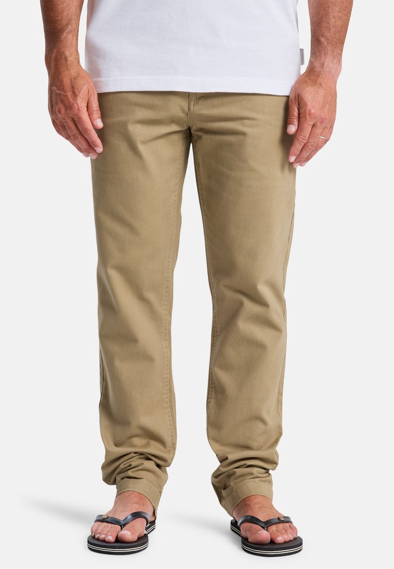 Khaki cotton pants with a straight fit, featuring front pockets and subtle stitching details, paired with black flip-flops.