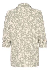 Kevyt, kermanvärinen pusero, jossa on vihreä, teksturoitu abstrakti kuvio, käärityt hihat ja terävä kaulus. Vain takaosa näkyvissä.