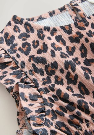 Leopard print fabric with a textured surface, featuring ruffled edges and a soft pink base with black and brown spots.