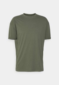 Oliven grøn bomulds t-shirt med korte ærmer, rund hals, afslappet pasform og opsmøgede manchetter. Glat tekstur og minimal detaljer.