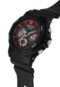 Schwarze Digitaluhr mit roten Akzenten und hexagonalen Zifferblättern, ausgestattet mit Datums- und Zeitanzeigen, drei seitlichen Tasten und einem Gummiband.