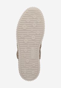 Semelle de chaussure en caoutchouc beige clair avec des motifs de crampons circulaires et linéaires. Présente des bords dentelés pour une meilleure traction. Surface texturée sur l'ensemble.