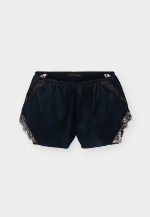 Svart satengshorts for kvinner med blondekant på sidene og elastisk midjebånd, lagt flatt på lys grå bakgrunn.