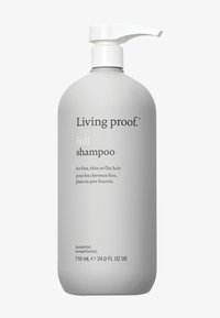 Grijze plastic fles van Living Proof® Full Shampoo met een witte pomp en zwarte tekst, gelabeld voor fijn, dun of plat haar. 710 mL.