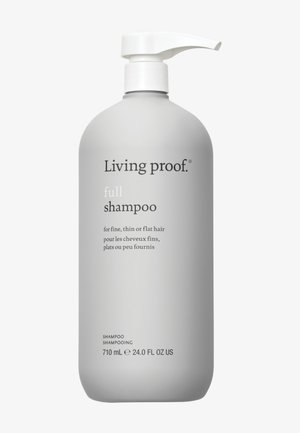 Bouteille en plastique grise de shampooing Living Proof® Full avec une pompe blanche et un texte noir, étiquetée pour les cheveux fins, fins ou plats. 710 mL.