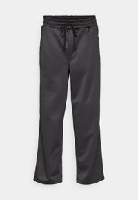 Schwarze Sporthose aus glattem Stoff, mit einem elastischen Bund und Kordelzug, Seitentaschen und einer lässigen Passform.