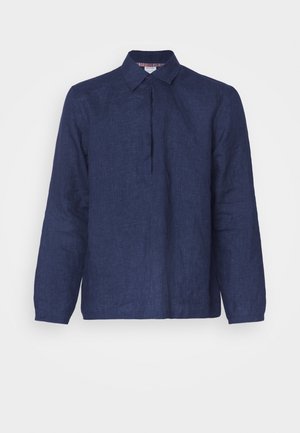 Navy blue linen shirt with long sleeves, a pointed collar, and a front pleat detail. Fabric has a subtle texture.