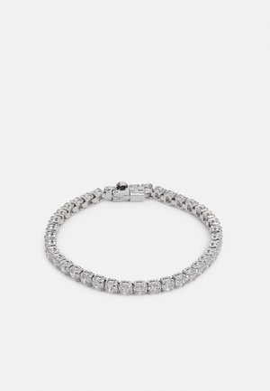 Pulseira de prata com uma fileira de pedras de zirconita cúbica transparentes em montagem de garras, com um fecho seguro e acabamento polido.