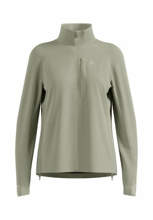 Hellolivgrüne Langarm-Sportjacke mit Reißverschluss und hohem Kragen, ausgestattet mit einer Brusttasche und einem kleinen Logo auf der linken Brust.