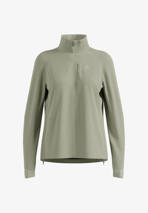Light olive green long-sleeve zip-up sports jacket with high collar and chest pocket, featuring a small logo on the left chest.