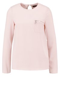 Light pink long-sleeve top with a round neckline, textured fabric, and a front pocket featuring a silver zipper and ring pull detail.