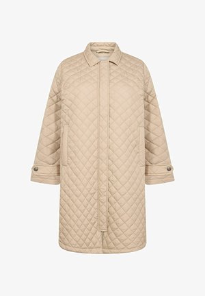 Pāršūts bežs mētelis ar apkakles kakla izgriezumu, taisnu griezumu, garām piedurknēm ar pogām un sānu kabatām papildu funkcionalitātei.