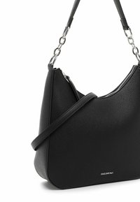Black leather shoulder bag with a sleek, rounded shape, silver hardware accents, and an adjustable strap. Textured outer surface with zipper detail.