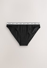 Culottes bikini en coton noir avec une ceinture élastique blanche affichant le texte répété "NEXT" en lettres noires.