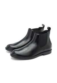 Svarta läder Chelsea-boots med elastiska sidopaneler, rundade tår och dragöglor. Slät yta och platta gummisulor.