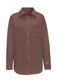 Brown long-sleeve shirt with a collar, button closure, a chest pocket, and a subtle logo accent at the cuff. Made from soft fabric.