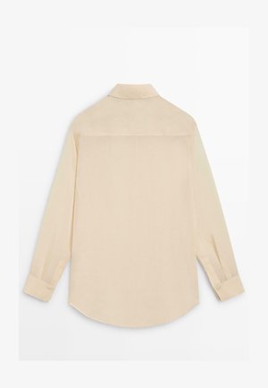 Beige long-sleeve buttoned shirt with a classic collar, shown from the back on a white background.