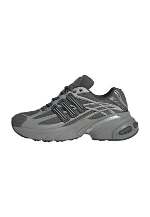 Grey athletic shoe with a mesh upper, synthetic overlays, padded collar, and rubber sole. Features textured patterns and a cushioned heel.