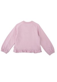 Sudadera de color rosa claro con escote redondeado, mangas raglán y dobladillo con volantes. Tejido suave y texturizado con puños fruncidos.