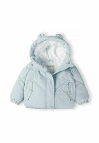 Világoskék puffert kívülről steppelt dizájnnal, túlméretezett kapucnival és mackófülekkel. Két elülső zsebbel és rugalmas mandzsettákkal rendelkezik.