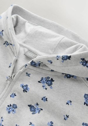 Grey zip-up hoodie featuring a floral pattern in blue tones, soft texture, and a kangaroo pocket design. Includes a drawstring hood.